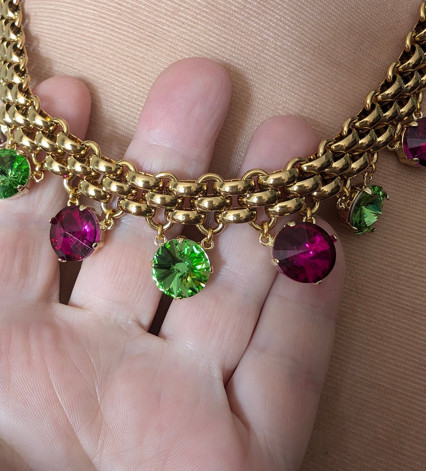 Chunky gold necklace with peridot and fuchsia charms