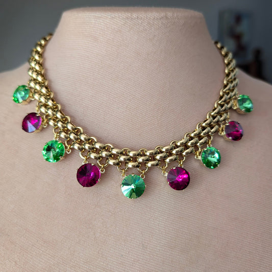 Chunky gold necklace with peridot and fuchsia charms
